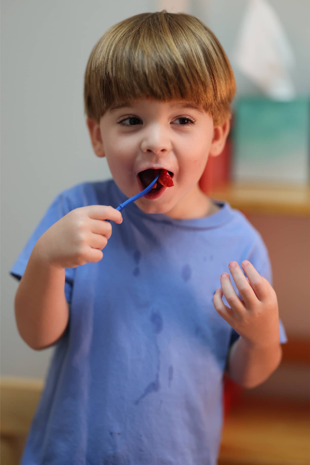 A young boy with a feeding disorder works on feeding therapy with Bliss Speech and Hearing Services.