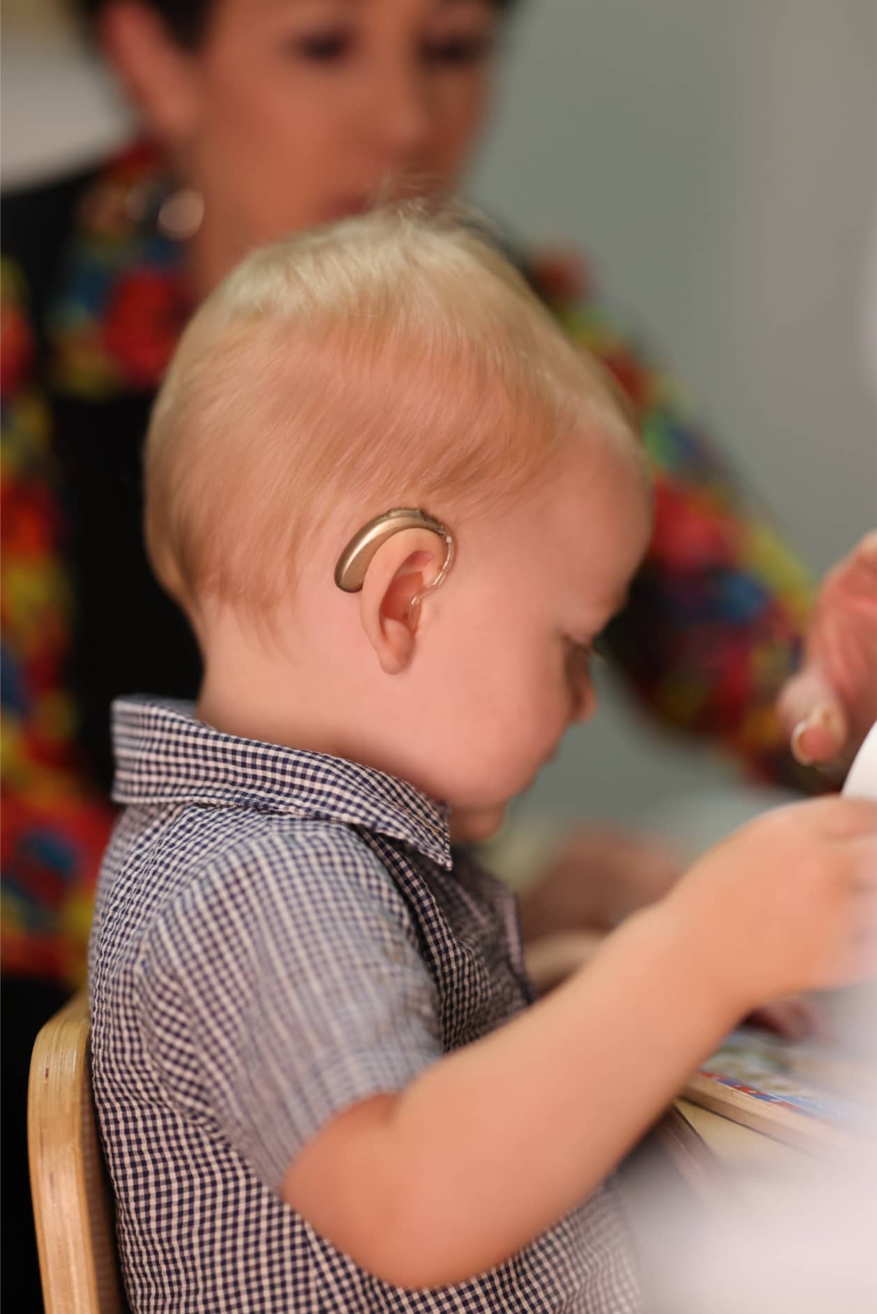 A baby with cochlear implant works with Auditory-Verbal Therapist at Bliss Speech and Hearing Services.