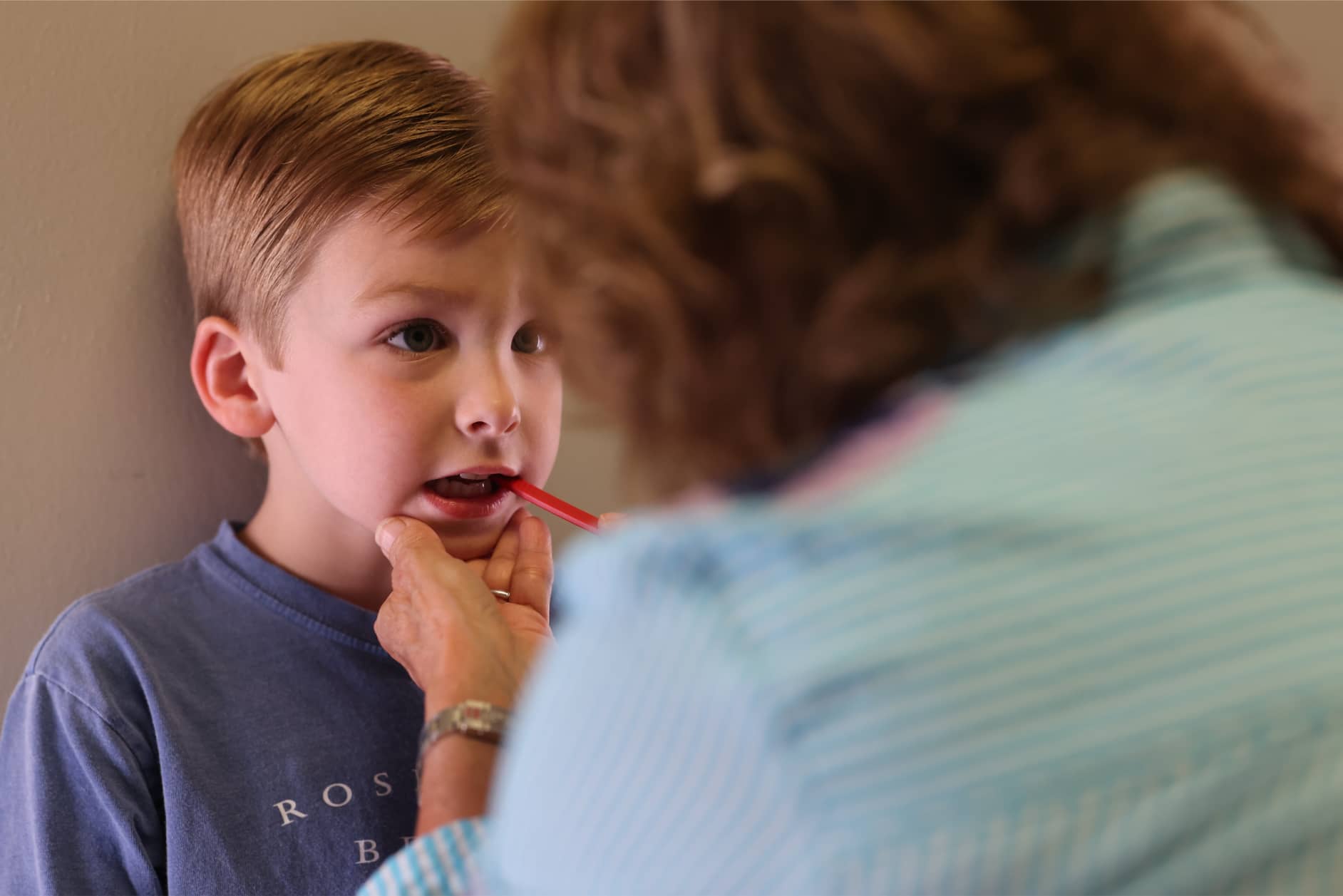 A young boy with an oral motor deficit works on oral motor function with Talk Tools at Bliss Speech and Hearing Services.