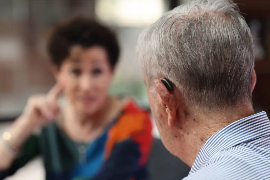 A man with Sensorineural hearing loss working on cochlear implant and aural rehab at Bliss Speech and Hearing Services.