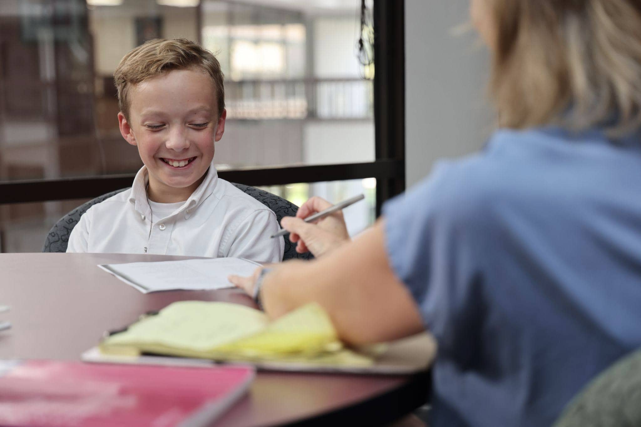 A young boy central auditory processing disorder (CAPD) works with Speech Pathologists at Bliss Speech and Hearing Services.