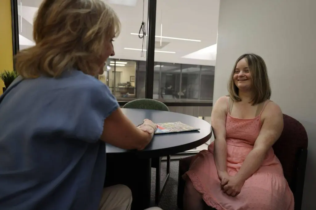 A teenage girl working on her speech and communication through individualized therapy at Bliss Speech and Hearing Services.