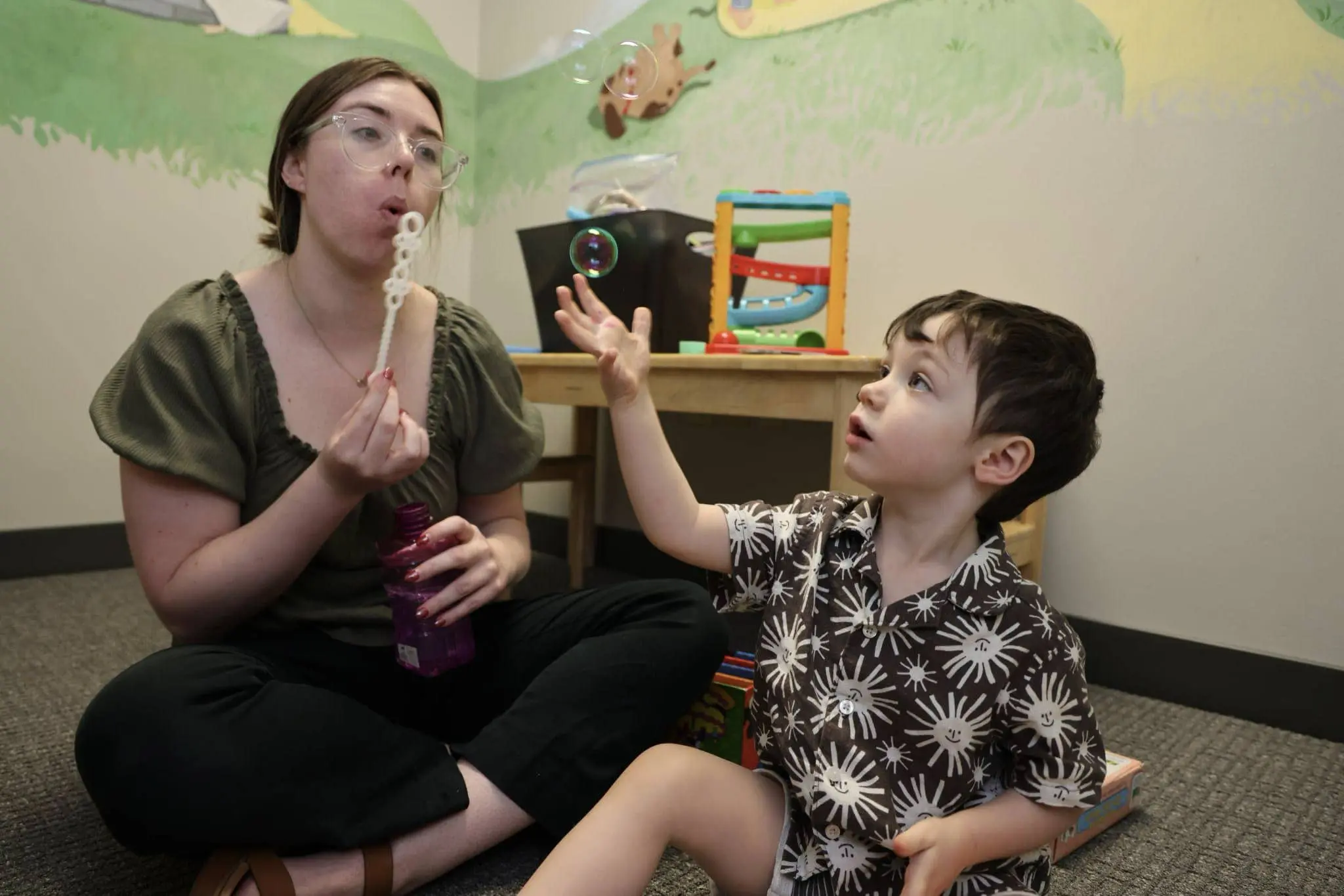 A young boy with developmental delays working on his communication skills at Bliss Speech and Hearing Services.